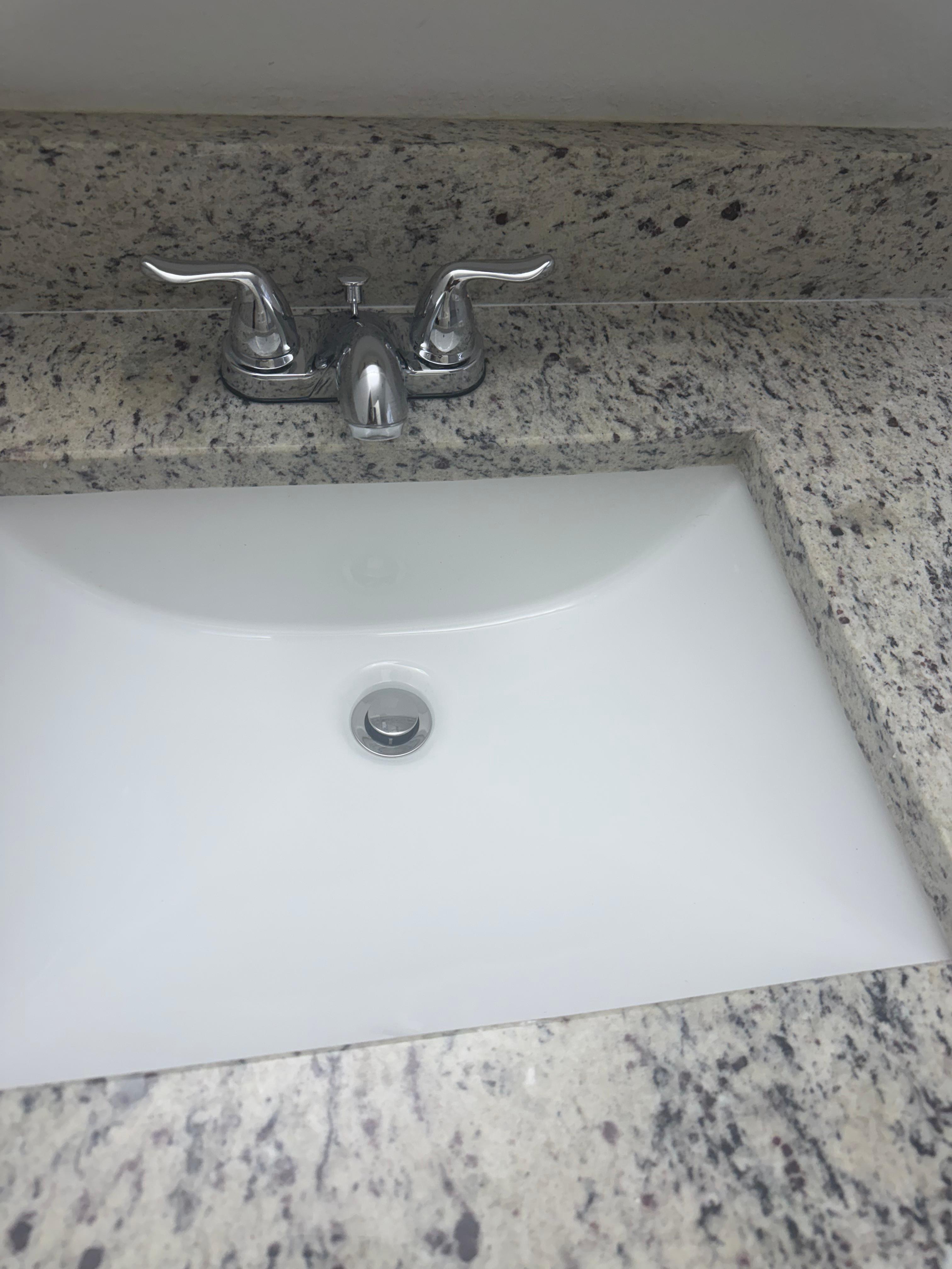 Same Tampa bathroom sink polished clean after professional cleaning