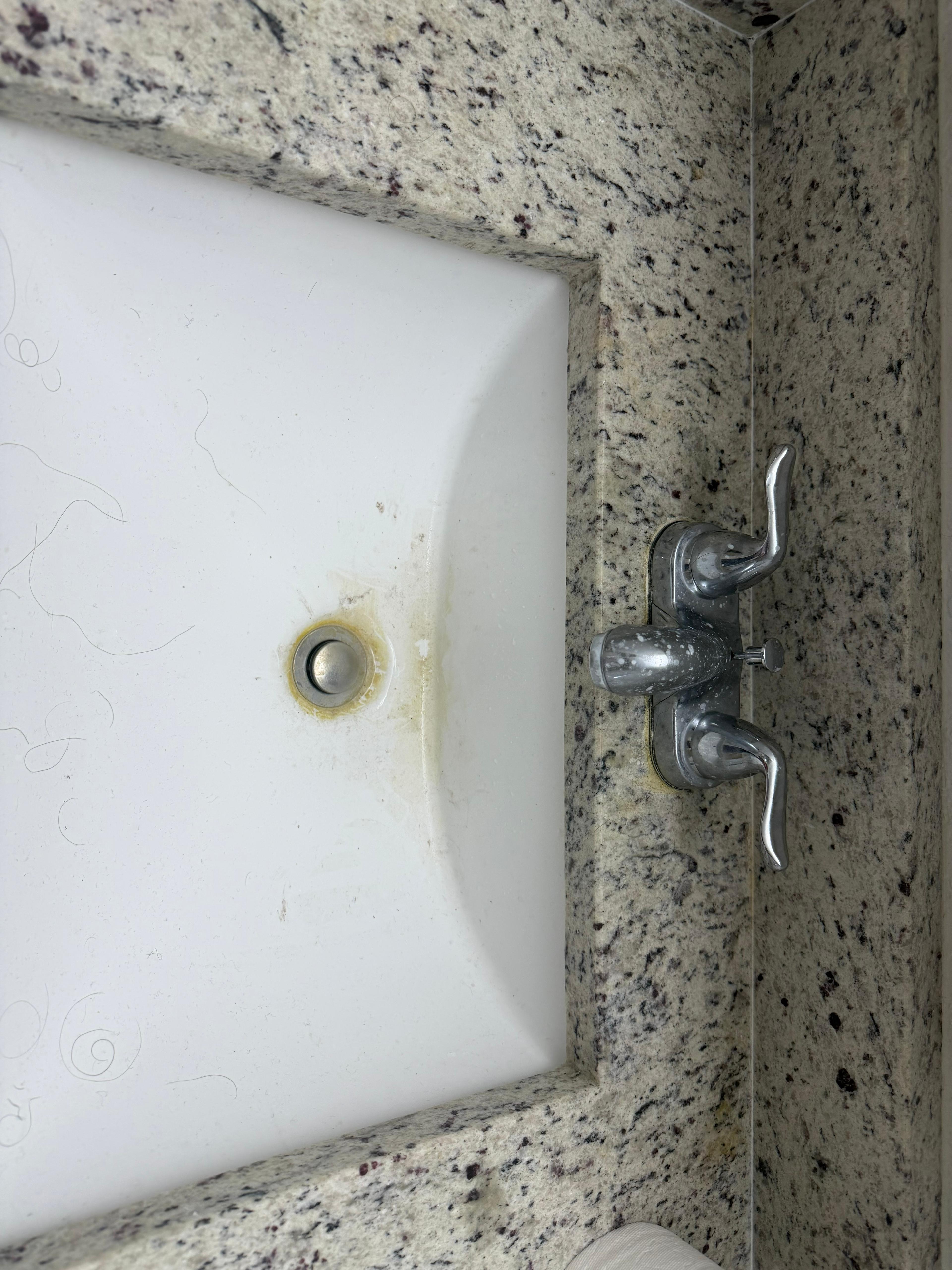 Tampa bathroom sink with grime around drain before cleaning